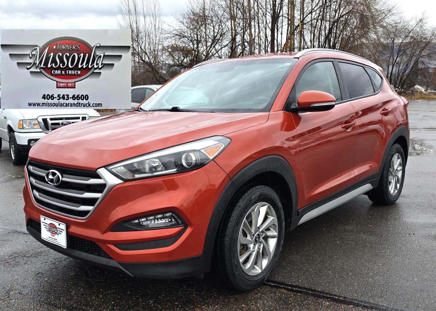 2017 Orange /Black Hyundai Tucson SE w/Preferred Package AWD (KM8J3CA44HU) with an 2.0L L4 DOHC 16V engine, 6A transmission, located at 450 N Russell, Missoula, MT, 59801, (406) 543-6600, 46.874496, -114.017433 - Beautiful Clean AWD SUV. 2.0L I4 Engine. 6 Speed Automatic Transmission. Heated Power Seats. Navigation. Infinity Sound System. AM FM SAT. Bluetooth Audio and Phone. Blindspot Detection. Backup Camera. - Photo#3