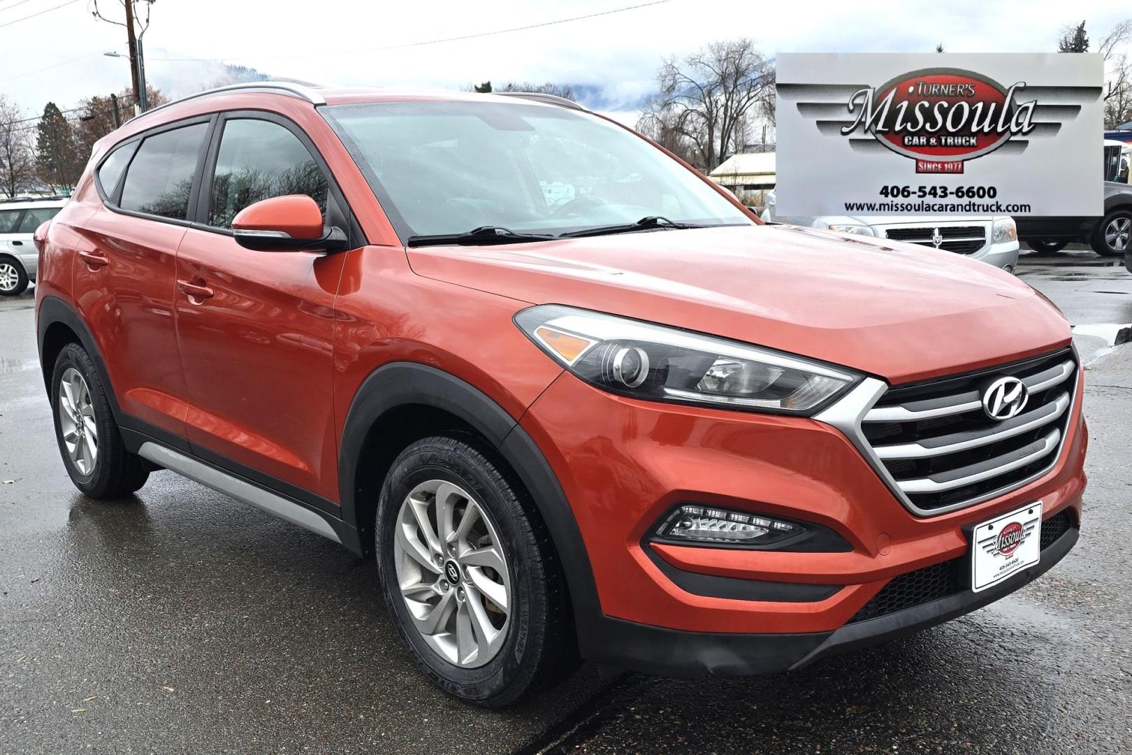 2017 Orange /Black Hyundai Tucson SE w/Preferred Package AWD (KM8J3CA44HU) with an 2.0L L4 DOHC 16V engine, 6A transmission, located at 450 N Russell, Missoula, MT, 59801, (406) 543-6600, 46.874496, -114.017433 - Beautiful Clean AWD SUV. 2.0L I4 Engine. 6 Speed Automatic Transmission. Heated Power Seats. Navigation. Infinity Sound System. AM FM SAT. Bluetooth Audio and Phone. Blindspot Detection. Backup Camera. - Photo#4