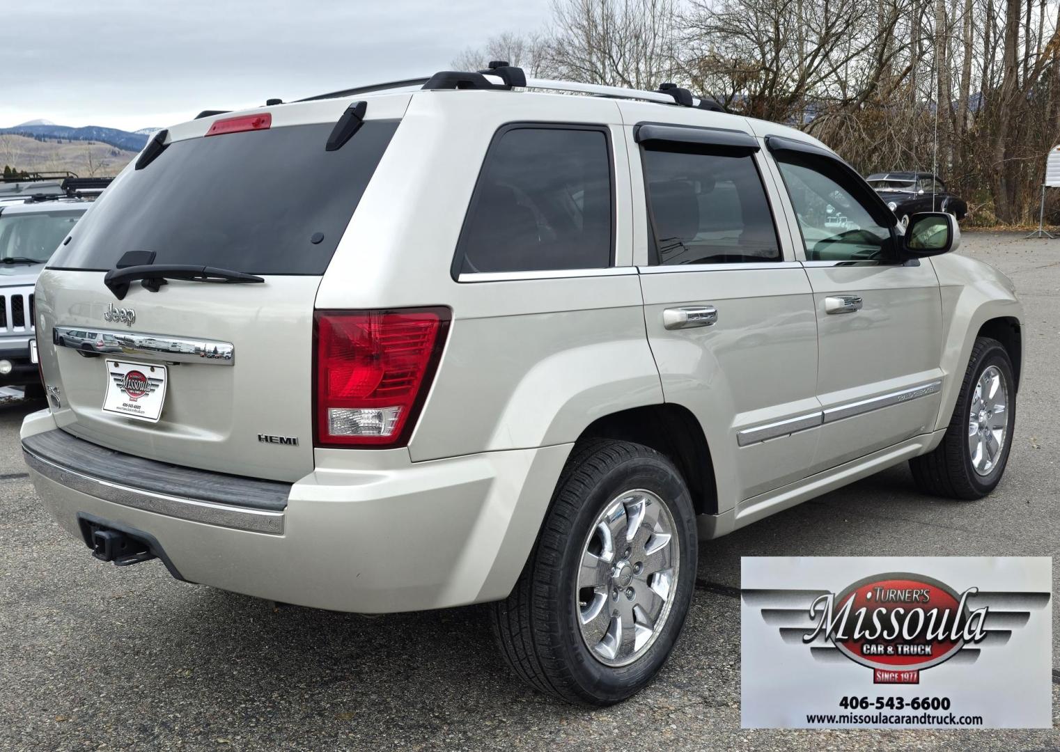 2009 Silver /White Jeep Grand Cherokee Overland 4WD (1J8HR68T49C) with an 5.7L V8 OHV 16V engine, 5-Speed Automatic transmission, located at 450 N Russell, Missoula, MT, 59801, (406) 543-6600, 46.874496, -114.017433 - Incredibly Nice Jeep Grand Cherokee Overland Edition 4WD SUV. 5.7 Hemi Engine. Leather Heated Front and Rear Seats. Power Seats. Navigation. Bluetooth. AM FM CD SAT. Power Sunroof. Power Windows and Locks. Remote Start. Towing. - Photo#2