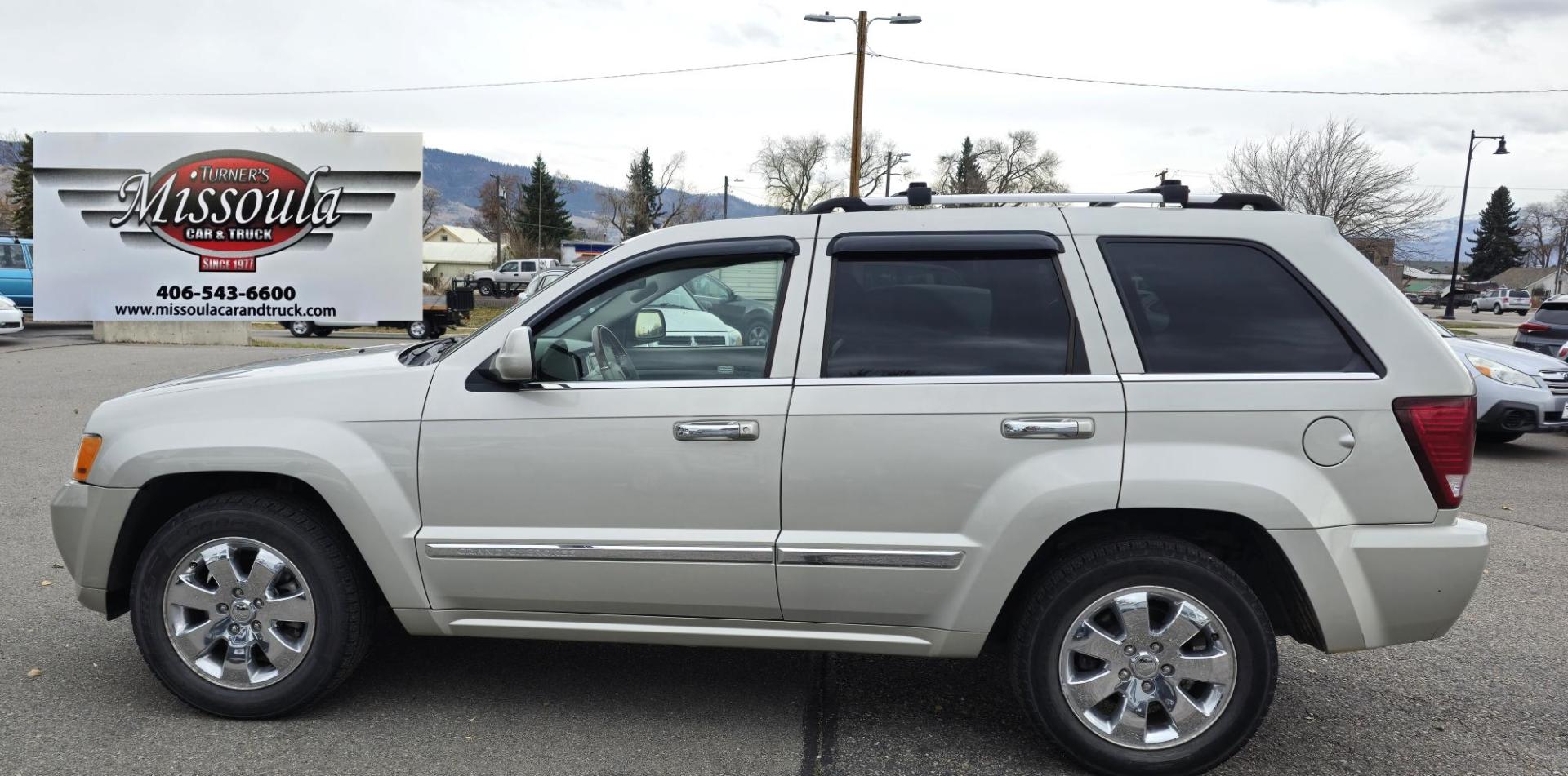 2009 Silver /White Jeep Grand Cherokee Overland 4WD (1J8HR68T49C) with an 5.7L V8 OHV 16V engine, 5-Speed Automatic transmission, located at 450 N Russell, Missoula, MT, 59801, (406) 543-6600, 46.874496, -114.017433 - Incredibly Nice Jeep Grand Cherokee Overland Edition 4WD SUV. 5.7 Hemi Engine. Leather Heated Front and Rear Seats. Power Seats. Navigation. Bluetooth. AM FM CD SAT. Power Sunroof. Power Windows and Locks. Remote Start. Towing. - Photo#5