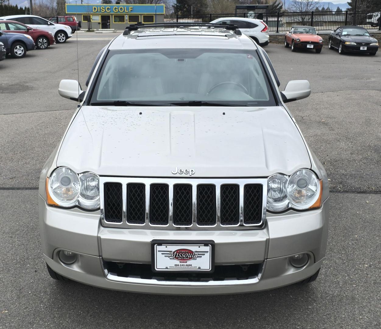 2009 Silver /White Jeep Grand Cherokee Overland 4WD (1J8HR68T49C) with an 5.7L V8 OHV 16V engine, 5-Speed Automatic transmission, located at 450 N Russell, Missoula, MT, 59801, (406) 543-6600, 46.874496, -114.017433 - Incredibly Nice Jeep Grand Cherokee Overland Edition 4WD SUV. 5.7 Hemi Engine. Leather Heated Front and Rear Seats. Power Seats. Navigation. Bluetooth. AM FM CD SAT. Power Sunroof. Power Windows and Locks. Remote Start. Towing. - Photo#7