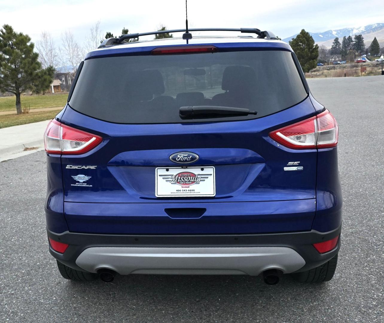 2014 Blue /Gray Ford Escape SE 4WD (1FMCU9GXXEU) with an 1.6L L4 DOHC 16V engine, 6-Speed Automatic transmission, located at 450 N Russell, Missoula, MT, 59801, (406) 543-6600, 46.874496, -114.017433 - One Owner 4WD with a Clean Carfax. 1.6L I4 Engine. Air. Cruise. Tilt. Bluetooth Audio and Phone. Sync Voice System. AM FM CD Sirius. - Photo#7