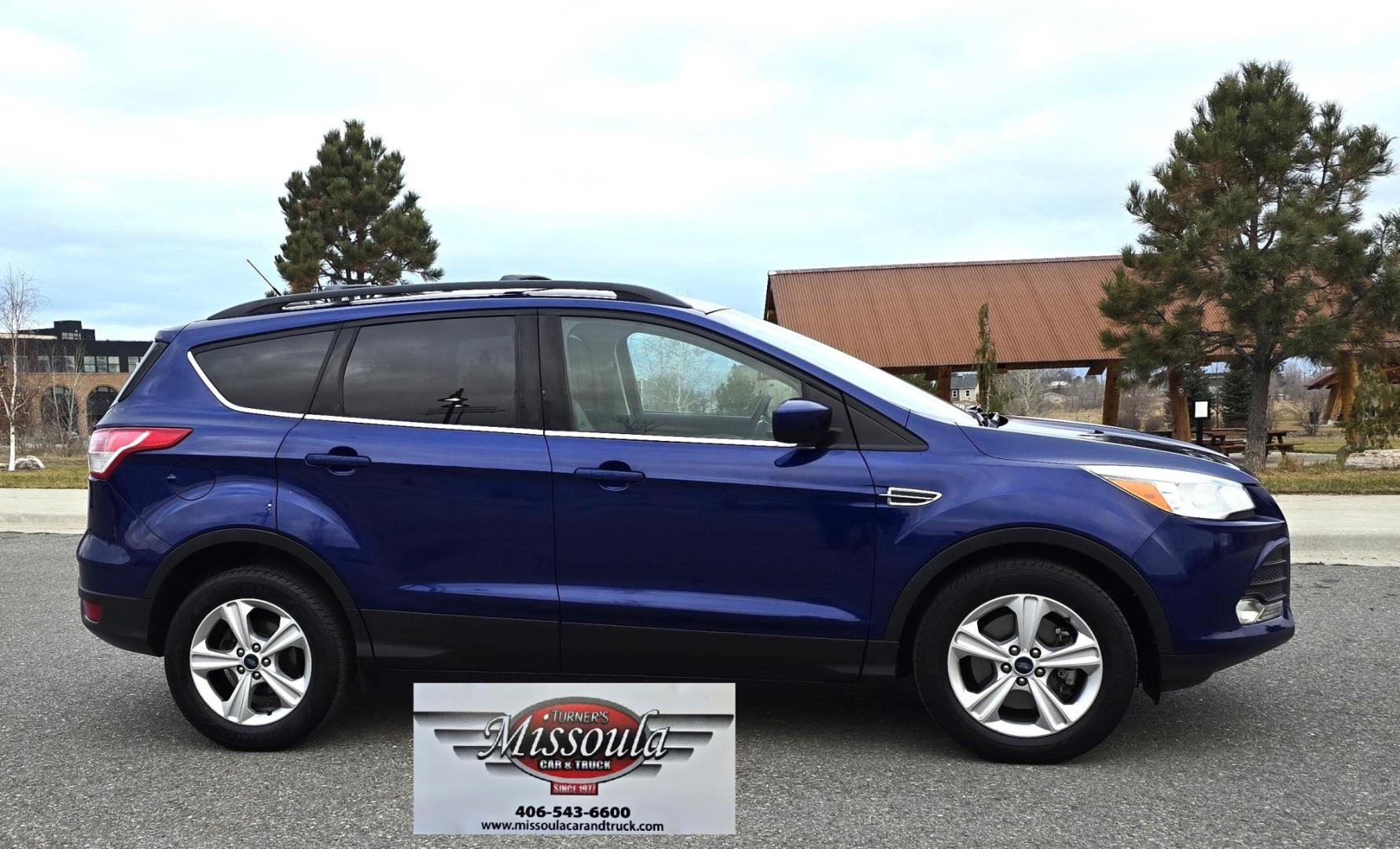 2014 Blue /Gray Ford Escape SE 4WD (1FMCU9GXXEU) with an 1.6L L4 DOHC 16V engine, 6-Speed Automatic transmission, located at 450 N Russell, Missoula, MT, 59801, (406) 543-6600, 46.874496, -114.017433 - One Owner 4WD with a Clean Carfax. 1.6L I4 Engine. Air. Cruise. Tilt. Bluetooth Audio and Phone. Sync Voice System. AM FM CD Sirius. - Photo#0