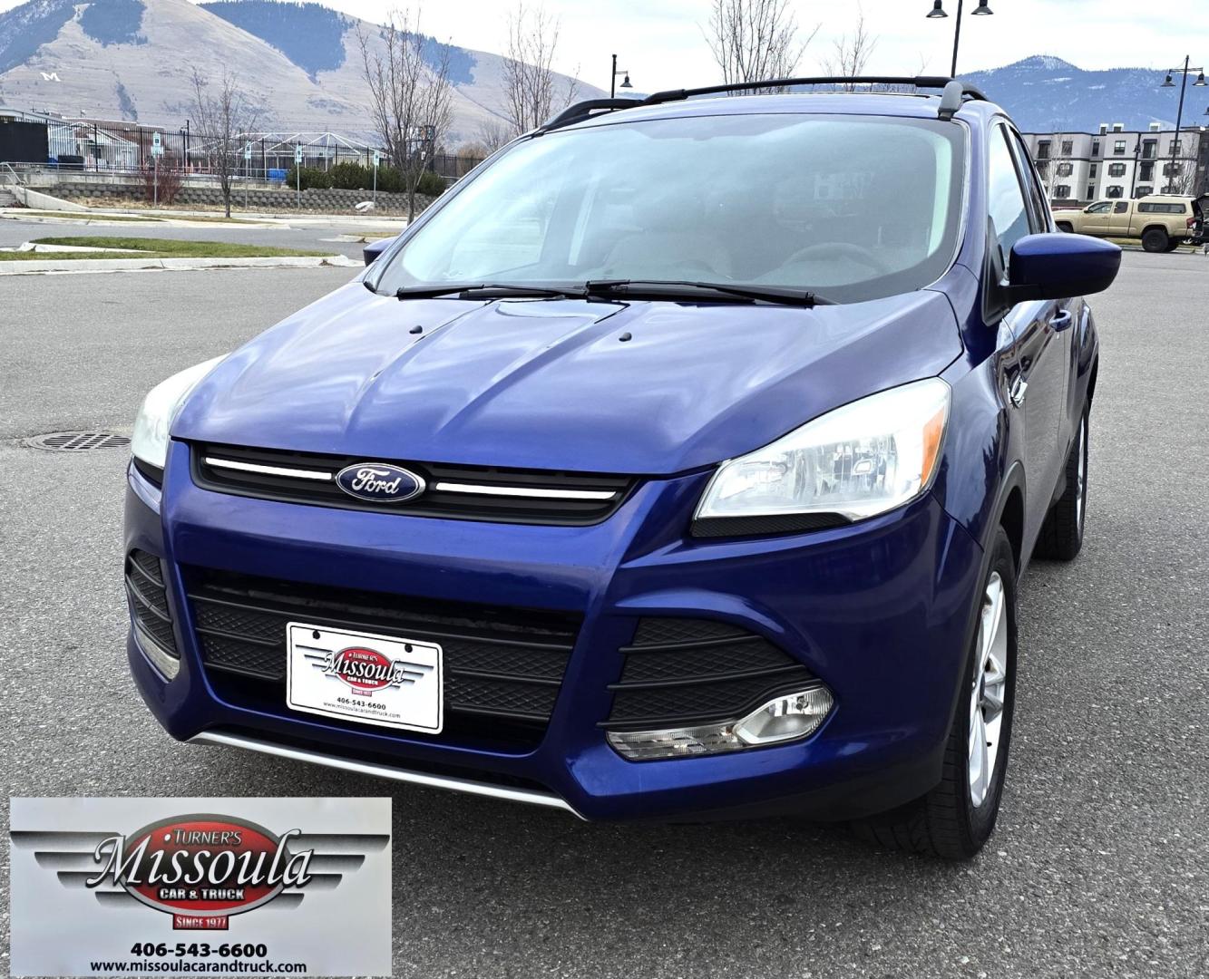 2014 Blue /Gray Ford Escape SE 4WD (1FMCU9GXXEU) with an 1.6L L4 DOHC 16V engine, 6-Speed Automatic transmission, located at 450 N Russell, Missoula, MT, 59801, (406) 543-6600, 46.874496, -114.017433 - One Owner 4WD with a Clean Carfax. 1.6L I4 Engine. Air. Cruise. Tilt. Bluetooth Audio and Phone. Sync Voice System. AM FM CD Sirius. - Photo#5