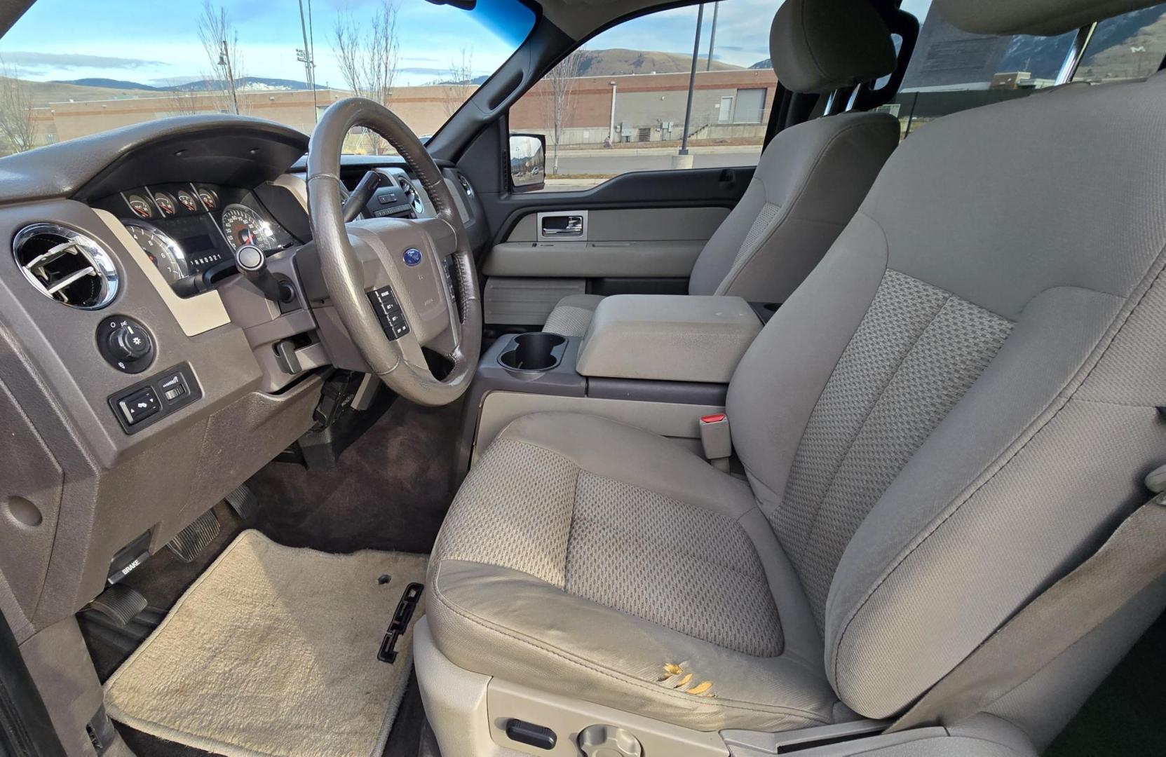 2010 Grey /Gray Ford F-150 XLT SuperCrew 5.5-ft. Bed 4WD (1FTFW1EV4AF) with an 5.4L V8 SOHC 24V FFV engine, 4-Speed Automatic transmission, located at 450 N Russell, Missoula, MT, 59801, (406) 543-6600, 46.874496, -114.017433 - Great Running F150 XLT 4WD. 5.4L V8. 6 Speed Automatic Transmission. 2 Owner with Clean Carfax. Power Drivers Seat. Air. Cruise. Tilt. Adjustable Pedals. Power Windows and Locks. AM FM XM CD. Bluetooth Audio and Phone. Running Boards. Topper and Timber Rack. - Photo#11