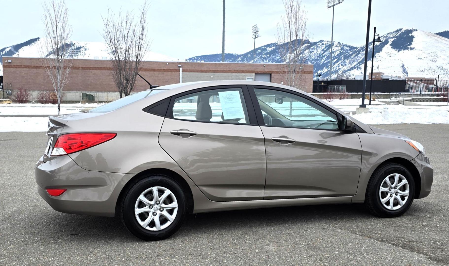 2013 Gold /Tan Hyundai Accent GLS 4-Door (KMHCT4AE2DU) with an 1.6L L4 DOHC 16V engine, Automatic transmission, located at 450 N Russell, Missoula, MT, 59801, (406) 543-6600, 46.874496, -114.017433 - Excellent Fuel economy Car. Runs Great. Only 88K Miles. 1.6L I4 Engine. Front Wheel Drive. Air Conditioning. AM FM XM CD Player. Tilt Steering. Power Windows and Locks. Keyless Entry. - Photo#1