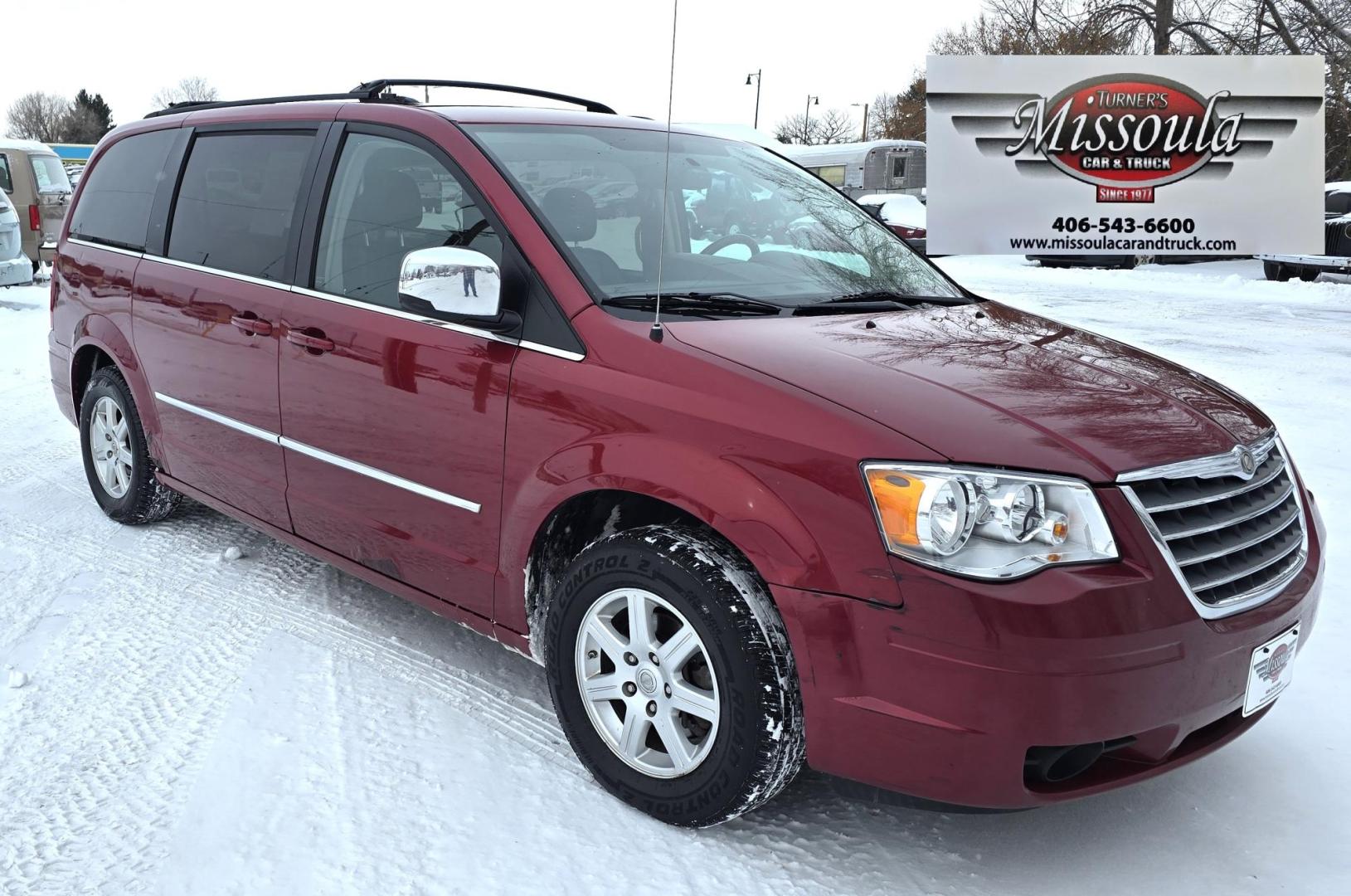 2010 Red /White Chrysler Town & Country Touring Plus (2A4RR8DX4AR) with an 4.0L V6 SOHC 24V engine, 6-Speed Automatic transmission, located at 450 N Russell, Missoula, MT, 59801, (406) 543-6600, 46.874496, -114.017433 - Very Clean Town and Country. 4.0L v6 Engine. Automatic Transmission. Front Wheel Drive. Heated Front Seats. Dual Climate Control. Front and Rear Entertainment. AM FM XM Bluetooth. 3rd Row Seating. Power Rear Doors. Remote start. Excellent Tires. One small dent. Has a "ESP BAS" Light on. Runs Amazing - Photo#4