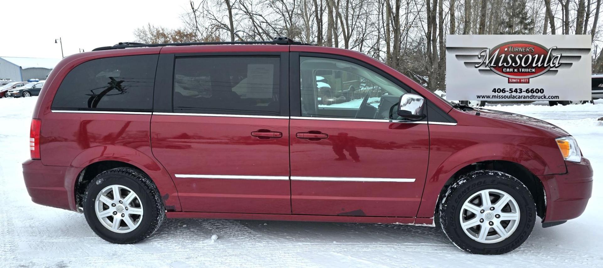 2010 Red /White Chrysler Town & Country Touring Plus (2A4RR8DX4AR) with an 4.0L V6 SOHC 24V engine, 6-Speed Automatic transmission, located at 450 N Russell, Missoula, MT, 59801, (406) 543-6600, 46.874496, -114.017433 - Very Clean Town and Country. 4.0L v6 Engine. Automatic Transmission. Front Wheel Drive. Heated Front Seats. Dual Climate Control. Front and Rear Entertainment. AM FM XM Bluetooth. 3rd Row Seating. Power Rear Doors. Remote start. Excellent Tires. One small dent. Has a "ESP BAS" Light on. Runs Amazing - Photo#2