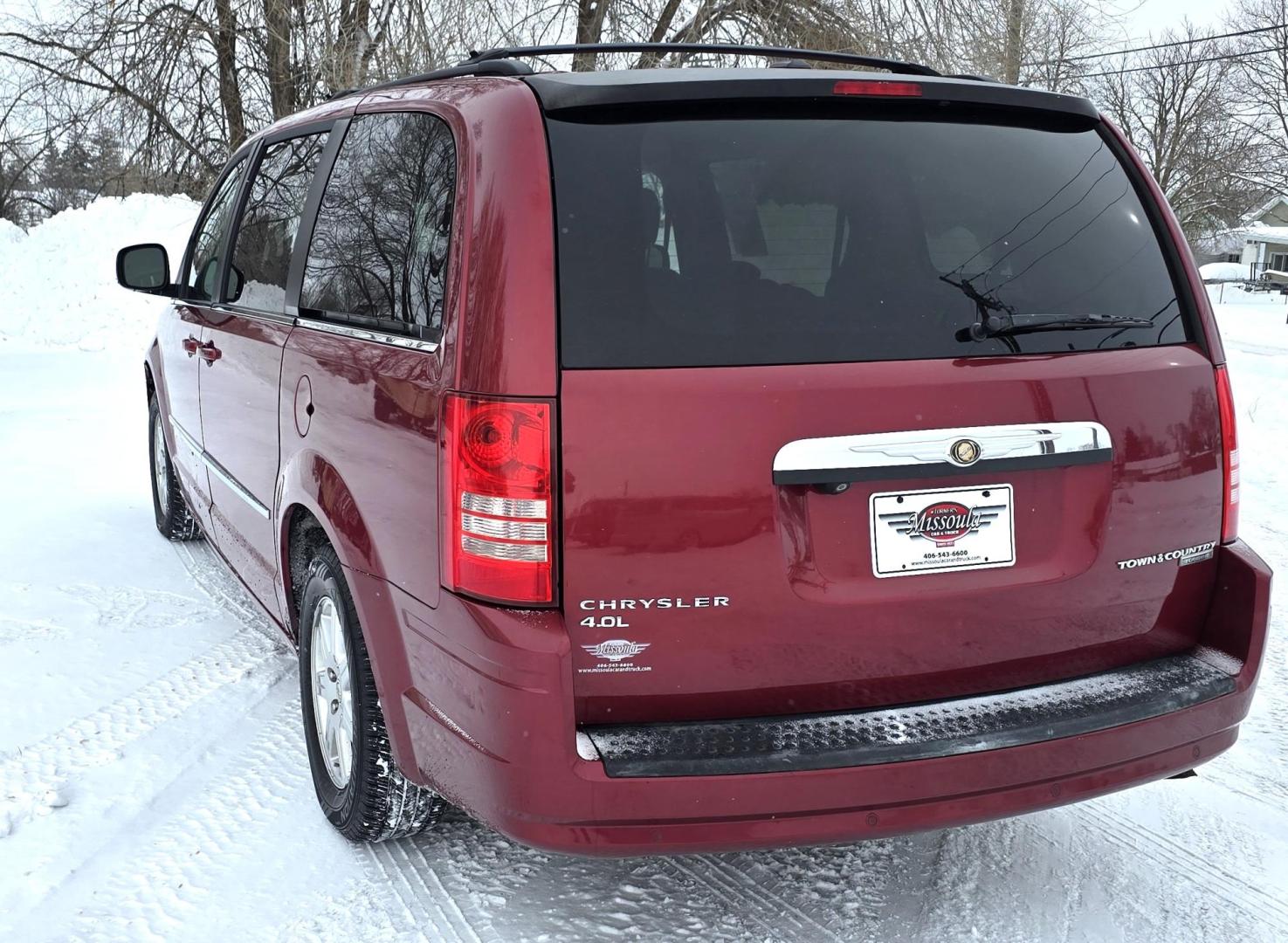 2010 Red /White Chrysler Town & Country Touring Plus (2A4RR8DX4AR) with an 4.0L V6 SOHC 24V engine, 6-Speed Automatic transmission, located at 450 N Russell, Missoula, MT, 59801, (406) 543-6600, 46.874496, -114.017433 - Very Clean Town and Country. 4.0L v6 Engine. Automatic Transmission. Front Wheel Drive. Heated Front Seats. Dual Climate Control. Front and Rear Entertainment. AM FM XM Bluetooth. 3rd Row Seating. Power Rear Doors. Remote start. Excellent Tires. One small dent. Has a "ESP BAS" Light on. Runs Amazing - Photo#7