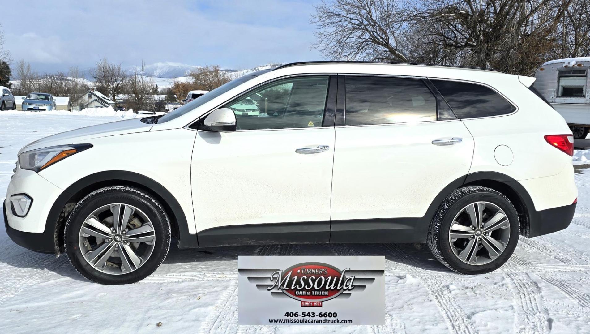 2013 White /Brown Hyundai Santa Fe Limited AWD (KM8SRDHF2DU) with an 3.3L V6 DOHC 24V engine, 6-Speed Automatic transmission, located at 450 N Russell, Missoula, MT, 59801, (406) 543-6600, 46.874496, -114.017433 - Nice One Owner AWD SUV. Clean Carfax. 3.3L V6 Engine. All Wheel Drive. Beautiful Brown Leather Interior. Heated Power Seats. Panoramic Sunroof. Heated Middle Seats. 3rd Row Seating. Infinity Sound System. AM FM XM CD Player. Navigation. Backup Camera. Heated Steering Wheel. Bluetooth Phone and Audio - Photo#3