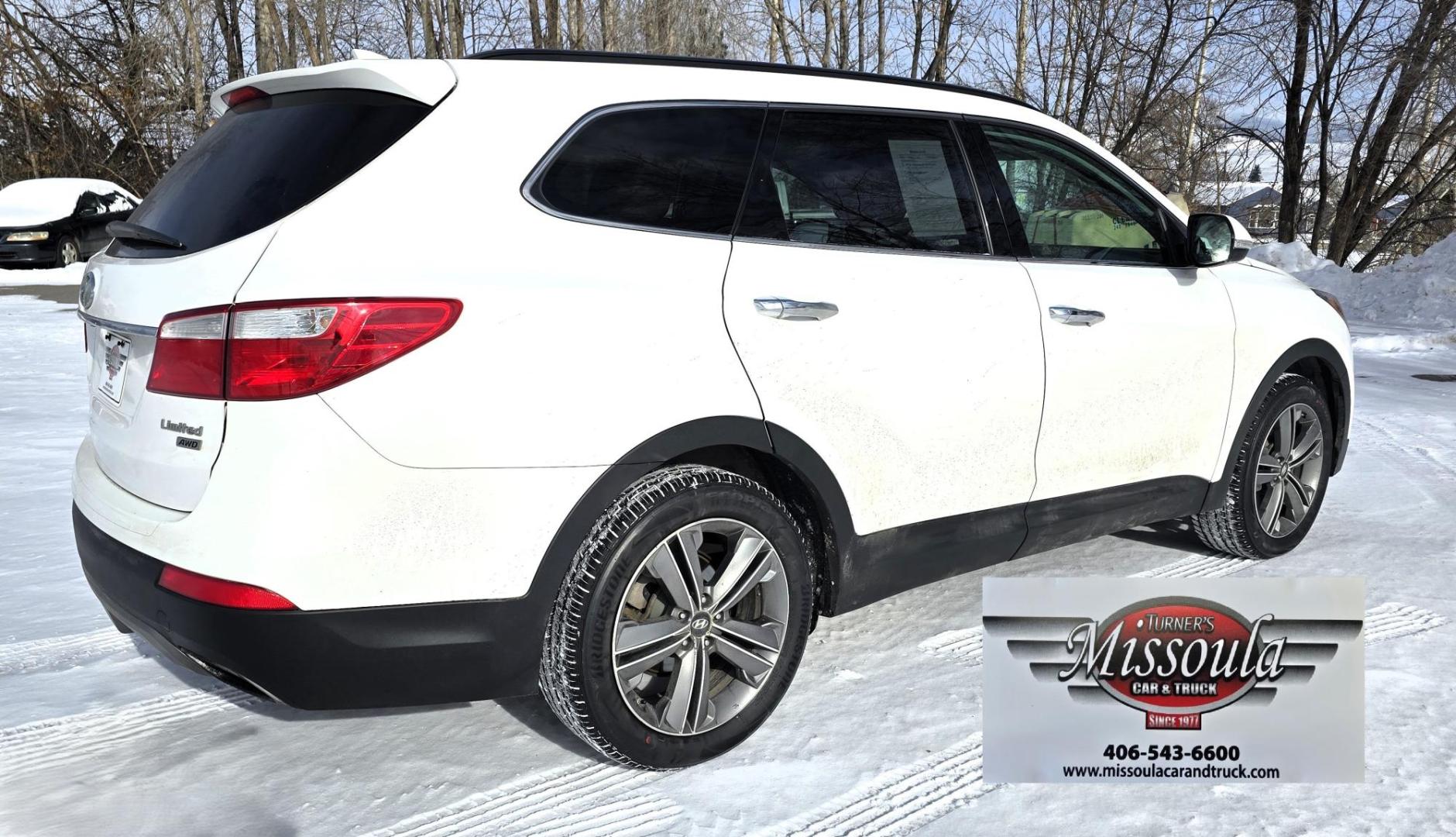 2013 White /Brown Hyundai Santa Fe Limited AWD (KM8SRDHF2DU) with an 3.3L V6 DOHC 24V engine, 6-Speed Automatic transmission, located at 450 N Russell, Missoula, MT, 59801, (406) 543-6600, 46.874496, -114.017433 - Nice One Owner AWD SUV. Clean Carfax. 3.3L V6 Engine. All Wheel Drive. Beautiful Brown Leather Interior. Heated Power Seats. Panoramic Sunroof. Heated Middle Seats. 3rd Row Seating. Infinity Sound System. AM FM XM CD Player. Navigation. Backup Camera. Heated Steering Wheel. Bluetooth Phone and Audio - Photo#4