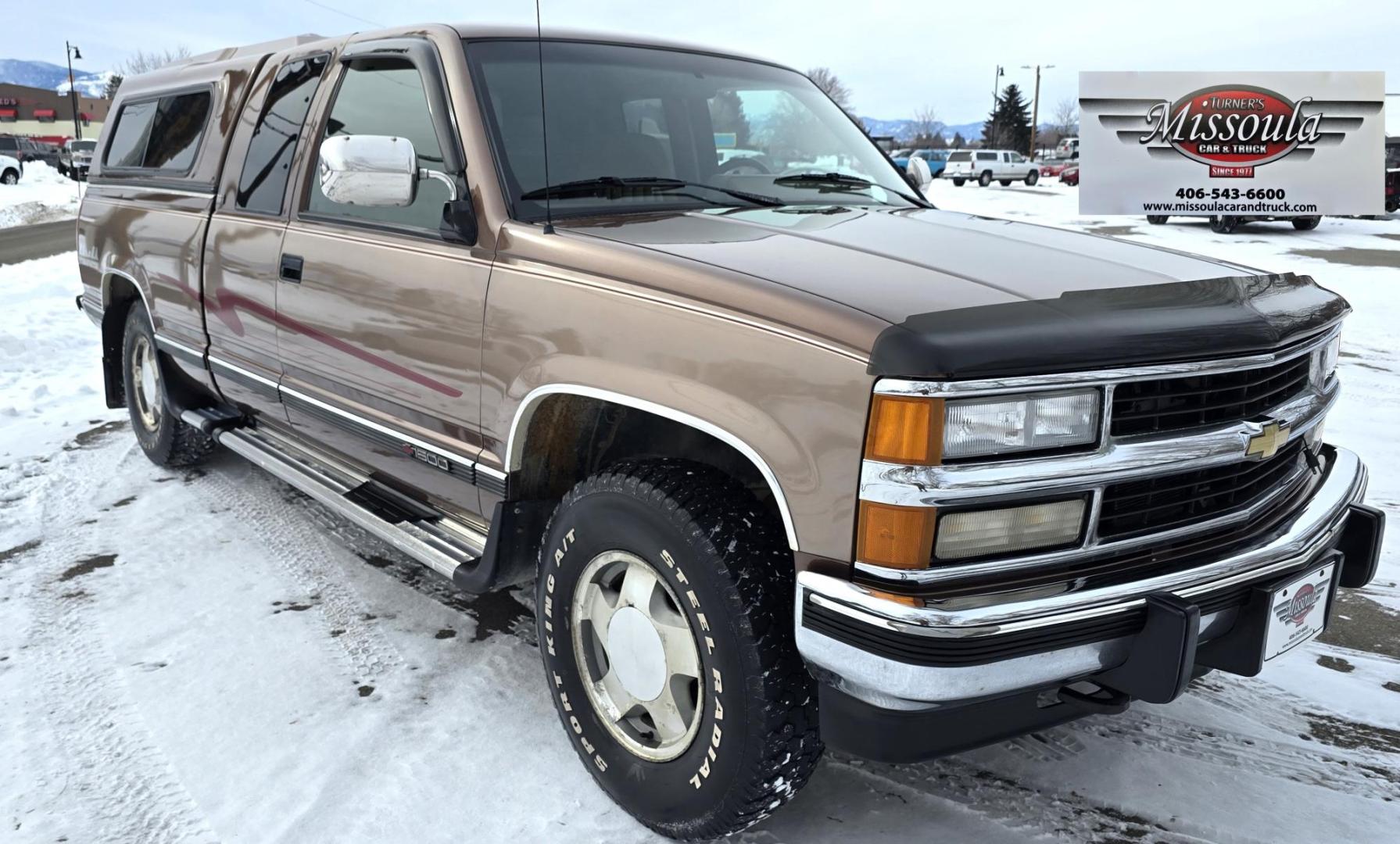 1994 Brown /Tan Chevrolet C/K 1500 Ext. Cab 6.5-ft. Bed 4WD (2GCEK19K0R1) with an 5.7L V8 OHV 16V engine, Automatic transmission, located at 450 N Russell, Missoula, MT, 59801, (406) 543-6600, 46.874496, -114.017433 - Beautiful old Chevy 4WD. 5.7L V8 Engine. Automatic Transmission. Air. Cruise. Tilt. Power Windows and Locks. Matching Topper. 2 Owner with a Clean Title and Carfax. Because of the age, our Credit Union does NOT offer financing on this vehicle. - Photo#3