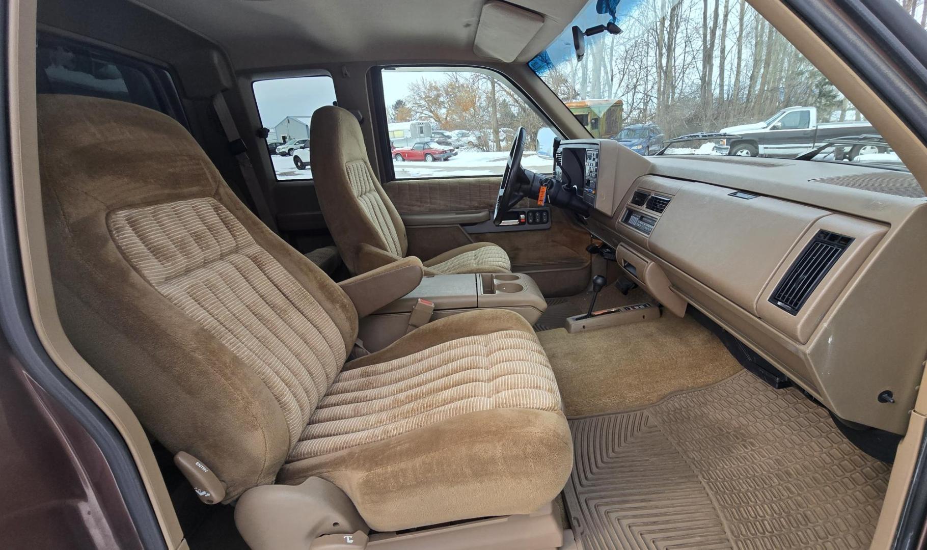 1994 Brown /Tan Chevrolet C/K 1500 Ext. Cab 6.5-ft. Bed 4WD (2GCEK19K0R1) with an 5.7L V8 OHV 16V engine, Automatic transmission, located at 450 N Russell, Missoula, MT, 59801, (406) 543-6600, 46.874496, -114.017433 - Beautiful old Chevy 4WD. 5.7L V8 Engine. Automatic Transmission. Air. Cruise. Tilt. Power Windows and Locks. Matching Topper. 2 Owner with a Clean Title and Carfax. Because of the age, our Credit Union does NOT offer financing on this vehicle. - Photo#8