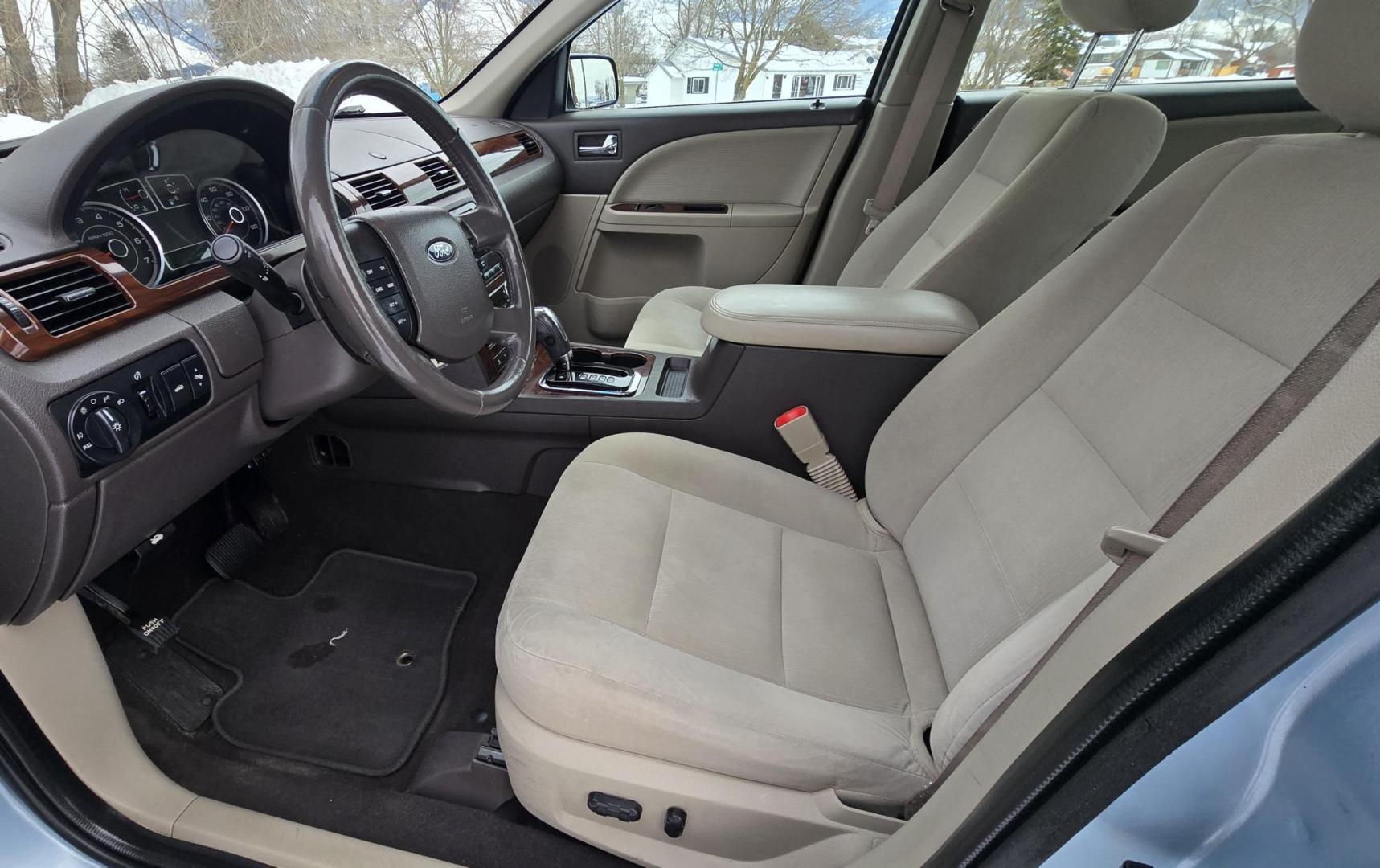 2008 Blue /Tan Ford Taurus SEL AWD (1FAHP27W98G) with an 3.5L V6 DOHC 24V engine, 6-Speed Automatic Overdrive transmission, located at 450 N Russell, Missoula, MT, 59801, (406) 543-6600, 46.874496, -114.017433 - Very Clean 2 Owner AWD Sedan. Only 78K Miles. 3.5L V6 Engine. Power Front Seats. Air. Cruise. Tilt. Power Windows and Locks. AM FM CD Player. - Photo#13