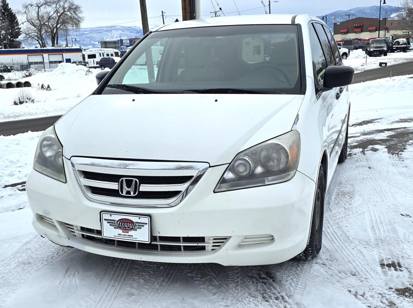 2007 White /Tan Honda Odyssey LX (5FNRL38247B) with an 3.5L V6 SOHC 24V engine, 5-Speed Automatic Overdrive transmission, located at 450 N Russell, Missoula, MT, 59801, (406) 543-6600, 46.874496, -114.017433 - Excellent Running Honda Minivan. FWD. 3.5L V6 Engine. 3rd Row Seating. Air. Cruise. Tilt. Power Windows and Locks. - Photo#1