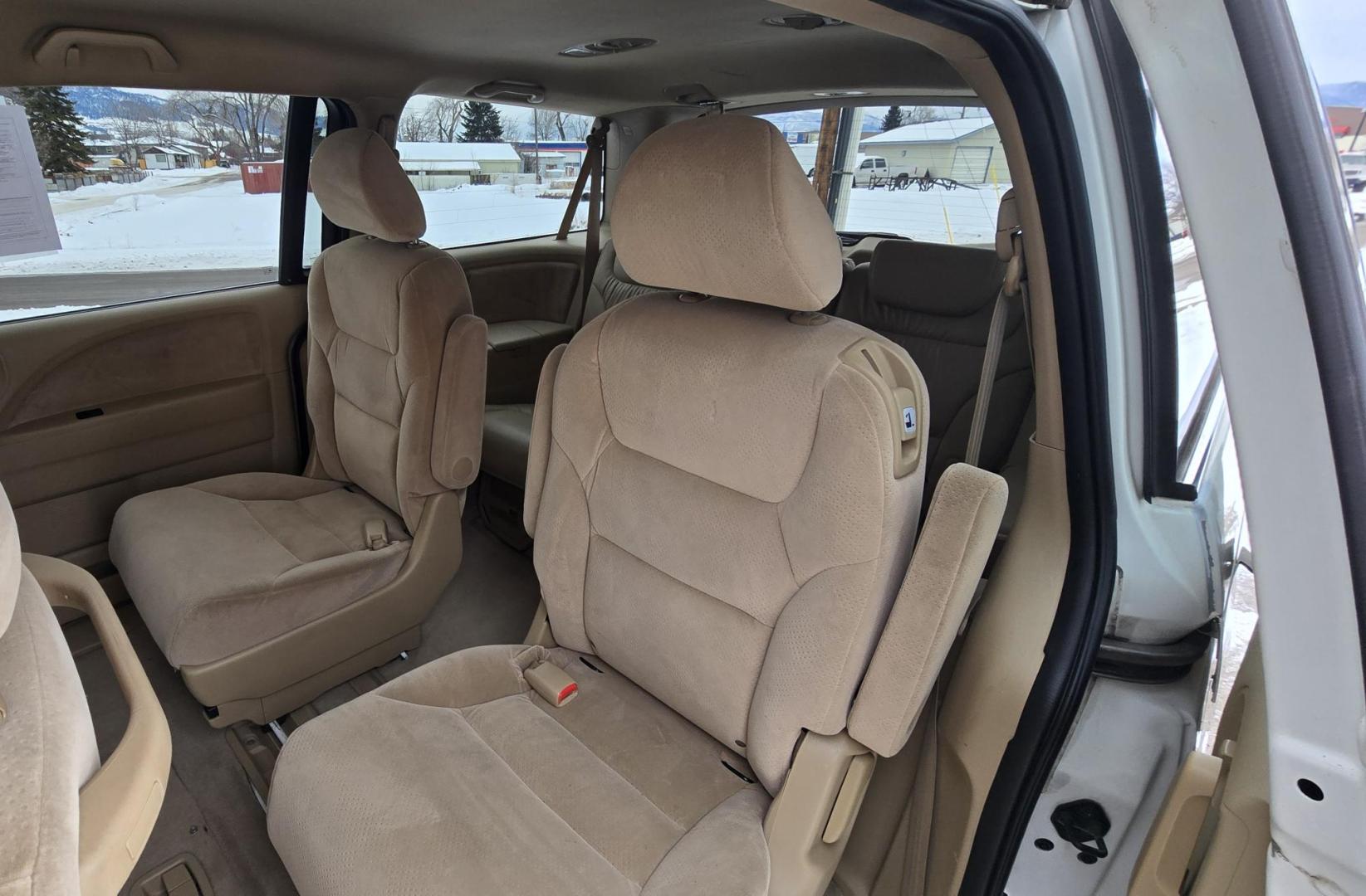 2007 White /Tan Honda Odyssey LX (5FNRL38247B) with an 3.5L V6 SOHC 24V engine, 5-Speed Automatic Overdrive transmission, located at 450 N Russell, Missoula, MT, 59801, (406) 543-6600, 46.874496, -114.017433 - Excellent Running Honda Minivan. FWD. 3.5L V6 Engine. 3rd Row Seating. Air. Cruise. Tilt. Power Windows and Locks. - Photo#13