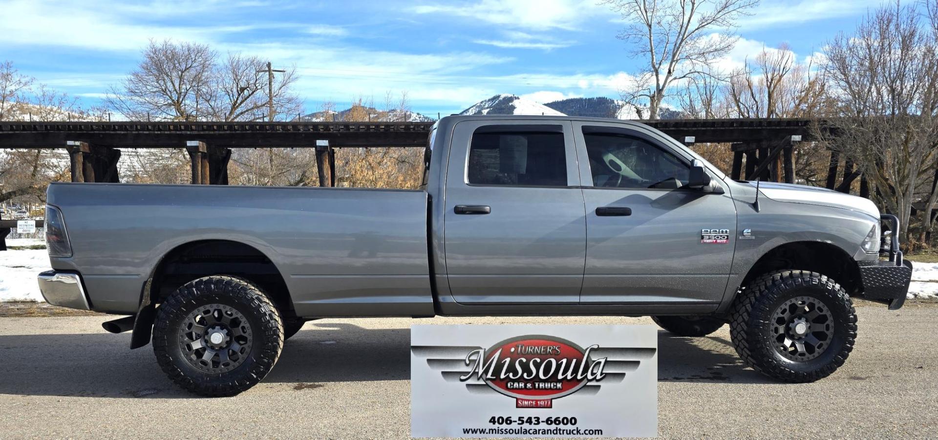 2012 Grey /Gray Dodge Ram 3500 ST Crew Cab LWB 4WD (3C63D3GL5CG) with an 6.7L L6 OHV 24V TURBO DIESEL engine, 6-Speed Automatic transmission, located at 450 N Russell, Missoula, MT, 59801, (406) 543-6600, 46.874496, -114.017433 - Looking for a Stud Truck? Here it is. Ram One Ton 4WD with a 6.7 Cummins Diesel Engine and a 6 Speed Manual Transmission (RARE).Light Bar Kit. Monster Grill Guard. After,marker Wheels with Beefy Tires. Power Windows and Locks. Built in Towing. Air. Cruise. Tilt. AM FM Bluetooth. - Photo#0