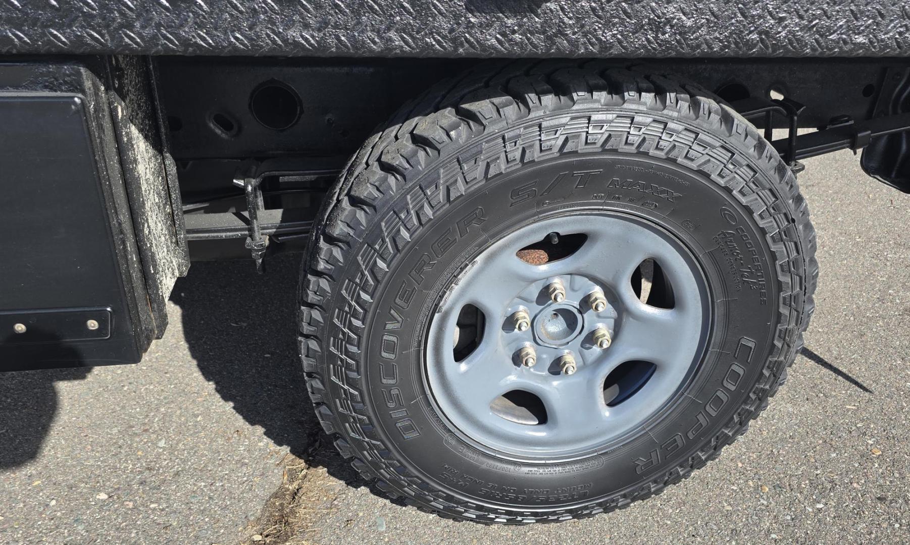 2003 White /Gray Chevrolet Silverado 1500 Long Bed 4WD (1GCEK14X73Z) with an 4.3L V6 OHV 12V engine, Automatic transmission, located at 450 N Russell, Missoula, MT, 59801, (406) 543-6600, 46.874496, -114.017433 - Work Truck that's ready for you.Strong Running 4.3 V6 Engine. 4WD. Automatic. Nice Flatbed with Tool Boxes on the side. Ladder / Lumber Rack. Gooseneck ball. Heavy Duty Rear Bumper for towing. Front Grill Guard. Air.Conditioning. Good Cooper Tires. Financing is NOT Available. - Photo#18