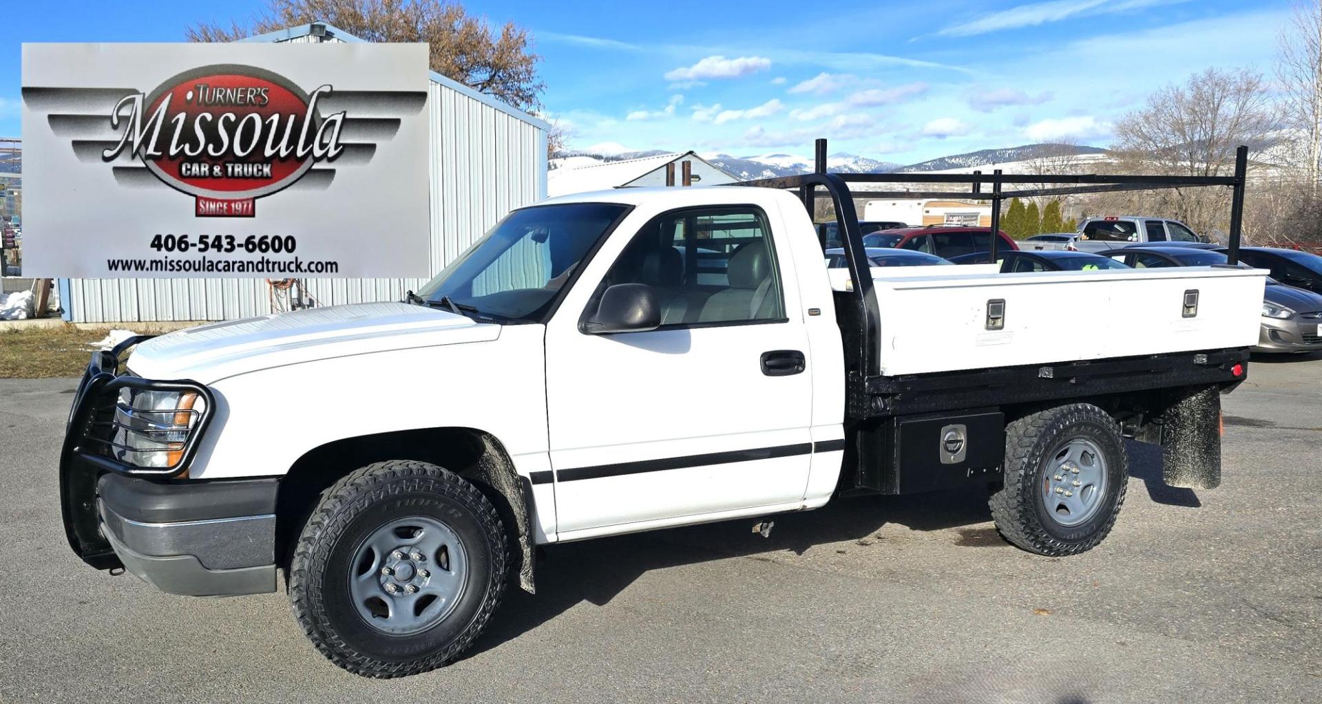 2003 White /Gray Chevrolet Silverado 1500 Long Bed 4WD (1GCEK14X73Z) with an 4.3L V6 OHV 12V engine, Automatic transmission, located at 450 N Russell, Missoula, MT, 59801, (406) 543-6600, 46.874496, -114.017433 - Work Truck that's ready for you.Strong Running 4.3 V6 Engine. 4WD. Automatic. Nice Flatbed with Tool Boxes on the side. Ladder / Lumber Rack. Gooseneck ball. Heavy Duty Rear Bumper for towing. Front Grill Guard. Air.Conditioning. Good Cooper Tires. Financing is NOT Available. - Photo#3