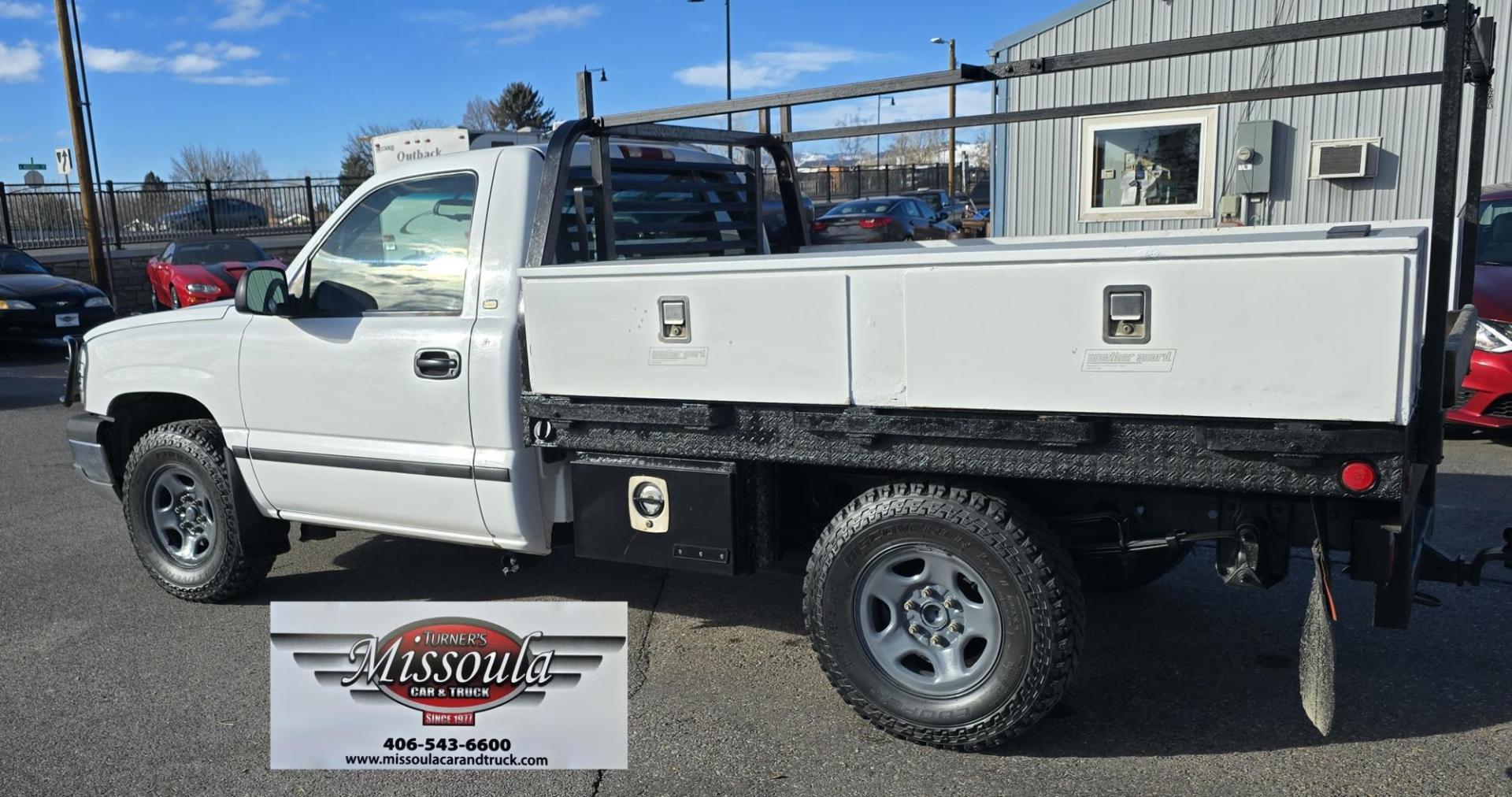 2003 White /Gray Chevrolet Silverado 1500 Long Bed 4WD (1GCEK14X73Z) with an 4.3L V6 OHV 12V engine, Automatic transmission, located at 450 N Russell, Missoula, MT, 59801, (406) 543-6600, 46.874496, -114.017433 - Work Truck that's ready for you.Strong Running 4.3 V6 Engine. 4WD. Automatic. Nice Flatbed with Tool Boxes on the side. Ladder / Lumber Rack. Gooseneck ball. Heavy Duty Rear Bumper for towing. Front Grill Guard. Air.Conditioning. Good Cooper Tires. Financing is NOT Available. - Photo#4