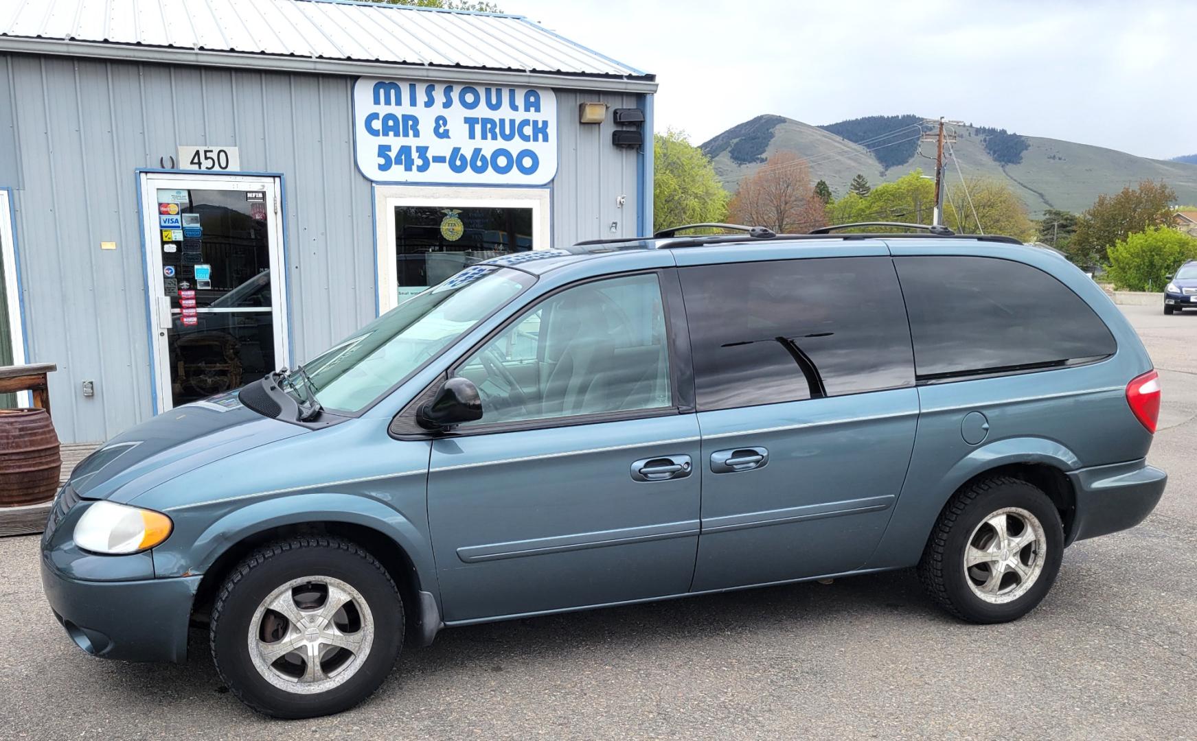 2006 Sage /Grey Cloth Dodge Grand Caravan SXT (2D4GP44L56R) with an 3.8L V6 SFI engine, 4 Speed Automatic transmission, located at 450 N Russell, Missoula, MT, 59801, (406) 543-6600, 46.874496, -114.017433 - Great running FWD Minivan. Only 103K Miles. 2 Sets of Tires and Wheels (Winter and Summer) 3rd Row Seating. Front and Rear Air Conditioning. Cruise Control. 3.8L V6 Engine. Automatic Transmission. Power Windows and Locks. AM FM CD. - Photo#1